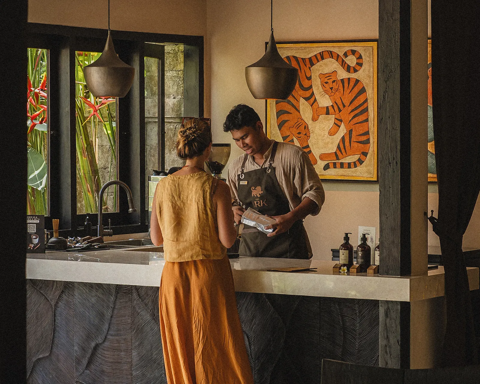 Hand-hammered brass pendant lamps over the café bar at The Ark