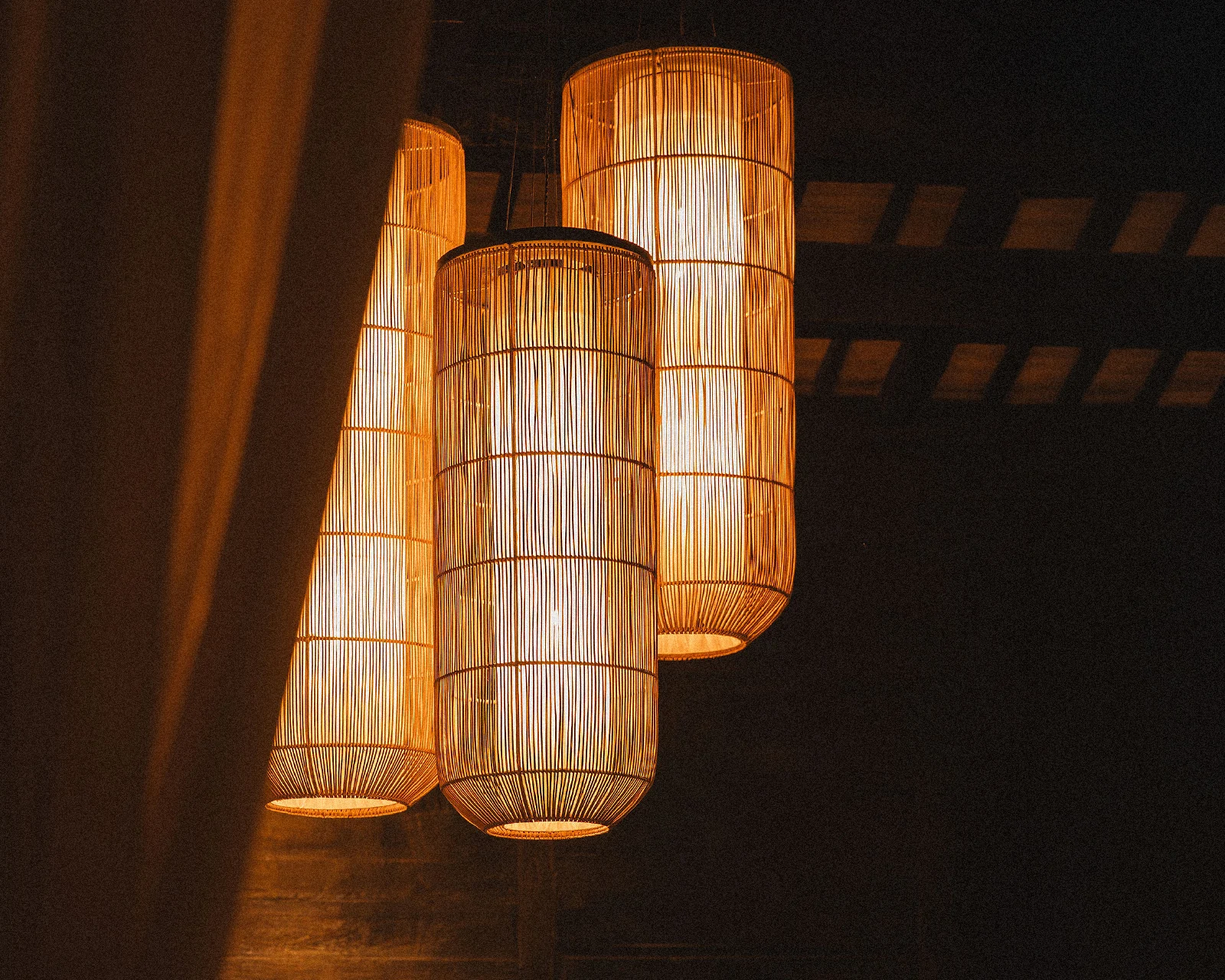 Glowing hand-woven rattan pendant lights at The Ark